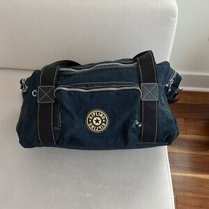 KIPLING NAVY BLUE DUFFLE WITH BLACK CANVAS STRAPS